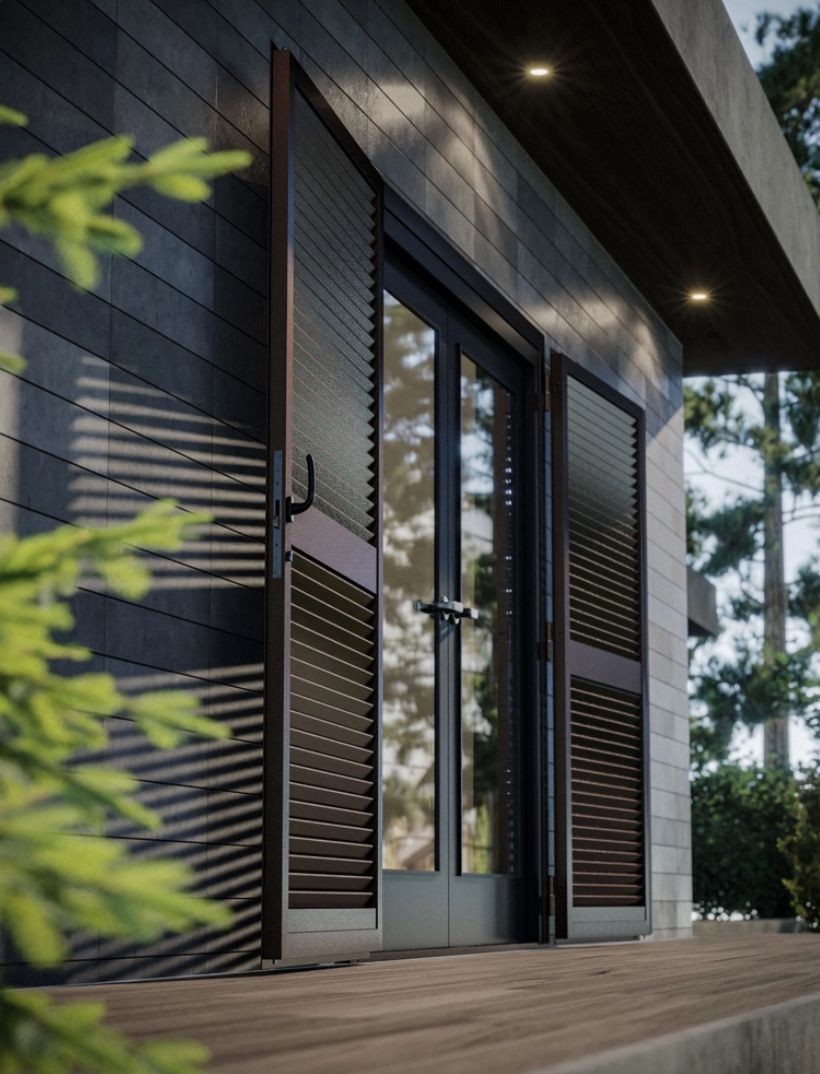 Modern house exterior with open louvered doors and wooden deck, surrounded by greenery.